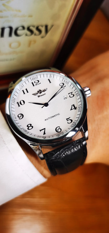 Reloj clásico para hombre: estilo retro con calendario y agujas azules, movimiento mecánico automático, marca de prestigio, caja de acero y correa de piel