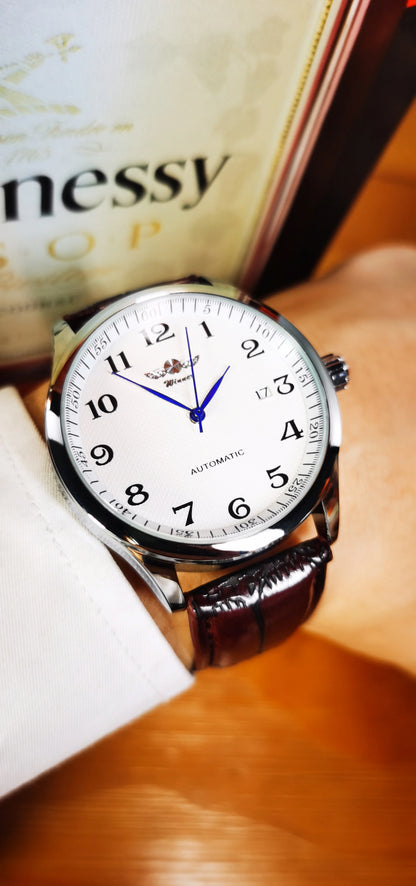 Reloj clásico para hombre: estilo retro con calendario y agujas azules, movimiento mecánico automático, marca de prestigio, caja de acero y correa de piel