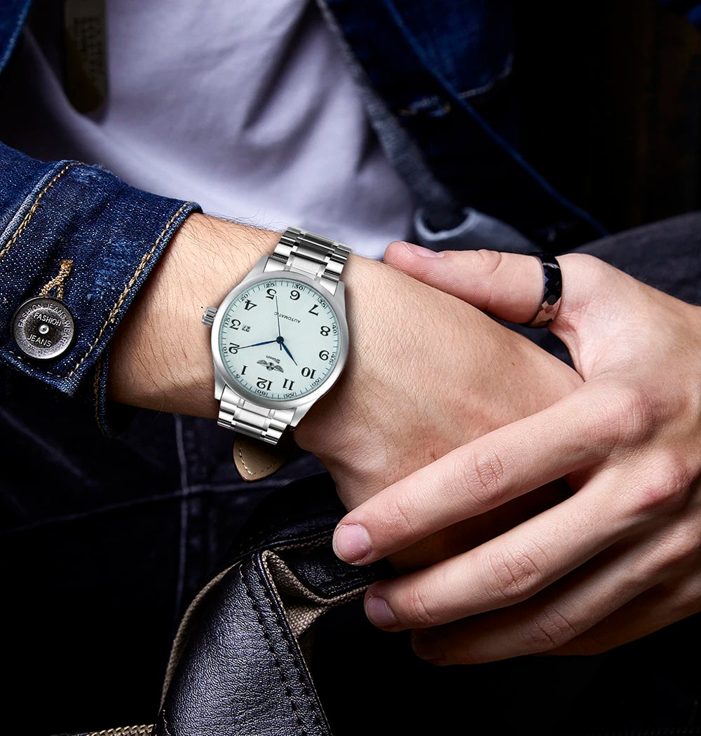 Reloj clásico para hombre: estilo retro con calendario y agujas azules, movimiento mecánico automático, marca de prestigio, caja de acero y correa de piel