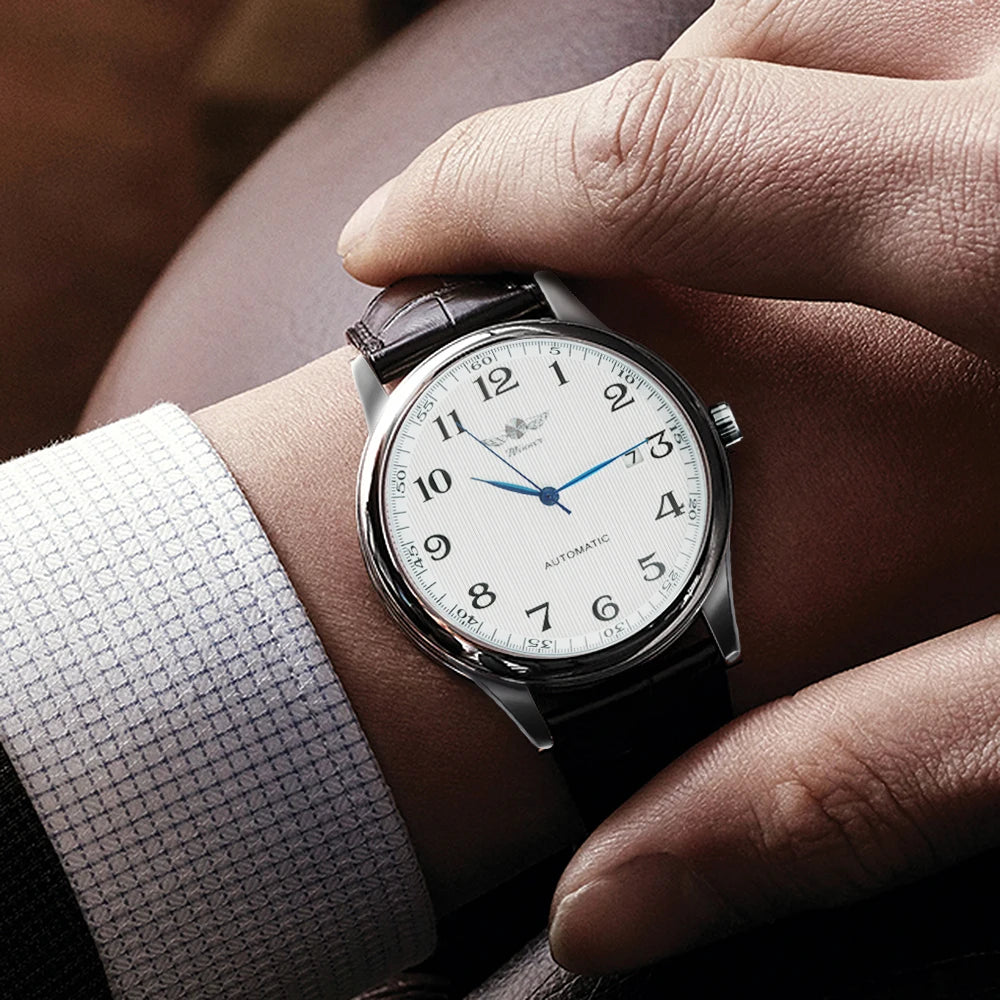 Reloj clásico para hombre: estilo retro con calendario y agujas azules, movimiento mecánico automático, marca de prestigio, caja de acero y correa de piel